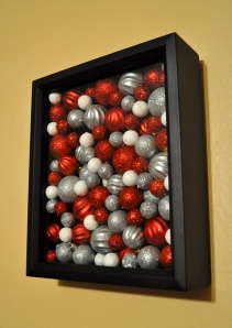 Put some ornaments in a shadowbox for a wall decoration